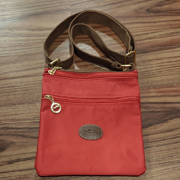 Longchamp Handbags - Longchamp Red Nylon Crossbody with Brown Strap